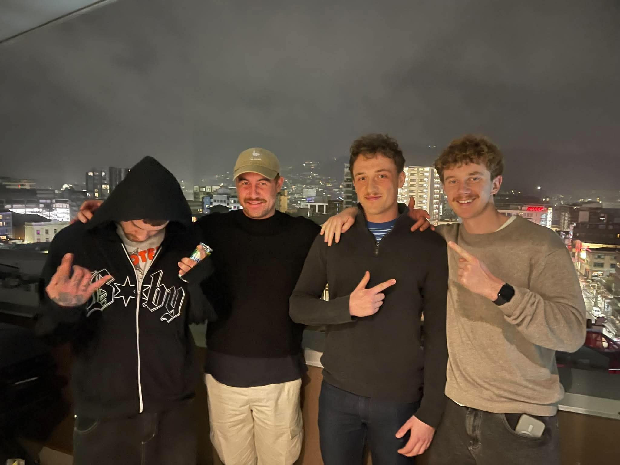 The four friends behind 69 Colognes together at night